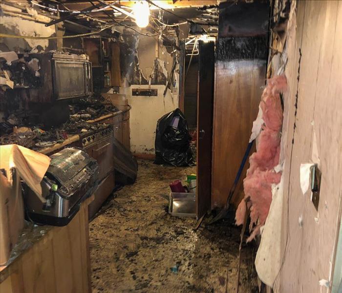 Kitchen severely damaged by fire. 