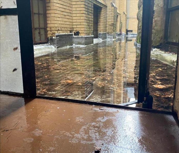 Wet floors and flooded outdoor area.