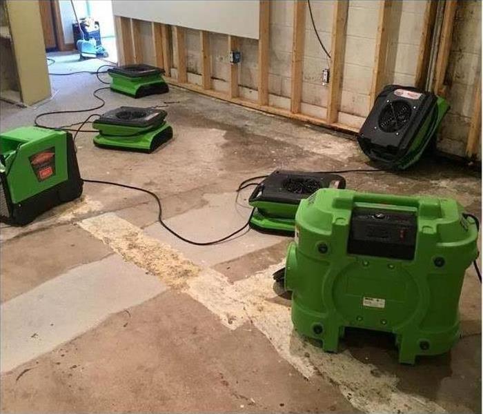 Drying equipment in a room and flood cuts were performed to drywall