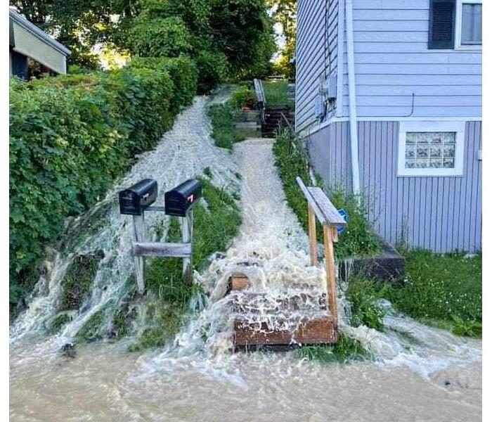 A house having outside flooding. 